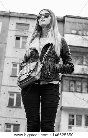 Yong beautiful white girl in urban background monochrome