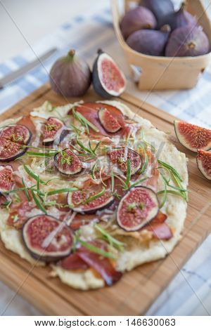 freshly baked French Flammkuchen with figs and cheese