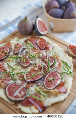 freshly baked French Flammkuchen with figs and cheese