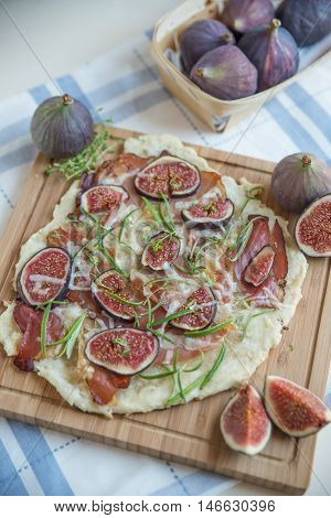freshly baked French Flammkuchen with figs and cheese