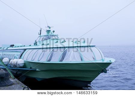 Passenger Hydrofoil Boat On The Docks Of Onego Lake In Foggy Weather, Petrozavodsk, Karelia, Russia.
