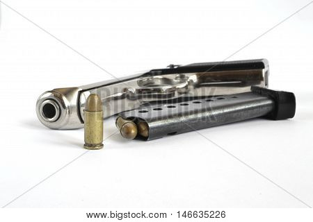 Pistol and ammunition on the white background.