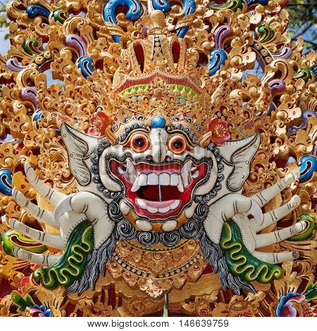 Traditional Barong mask pattern in temple - protective spirit Bali island symbol. Featured in Balinese dances and ceremonies. Culture religion Arts festivals of Indonesian people. Travel background