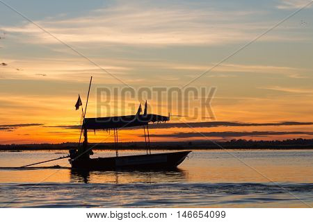 Boat and driver under the morning sun.