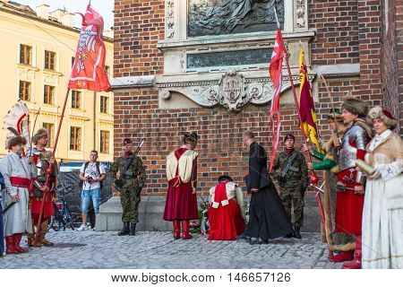 KRAKOW, POLAND - FEB 10, 2016: Unidentified participants of ceremony is the vow of first classes of the Jan III Sobieski High School (founded in 1883) at the Main Market Square near St.Mary Cathedral.