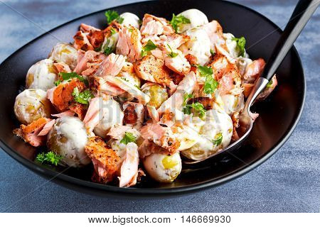 Salmon and young potato warm salad with a lemony yogurt dressing.