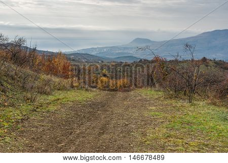 View from mountain pasture Demerdzhi down to Black Sea shore and Alushta resort at autumnal morning Crimea Ukraine.