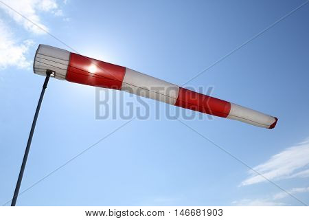 wind sleeve flying on a blue sky