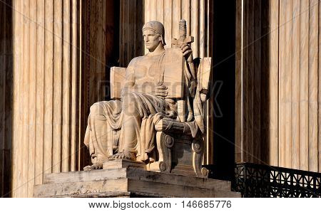 Washington DC - April 12 2014: The Authority of Law sculpture by James Fraser on the right side of the of the U. S.Supreme Court *