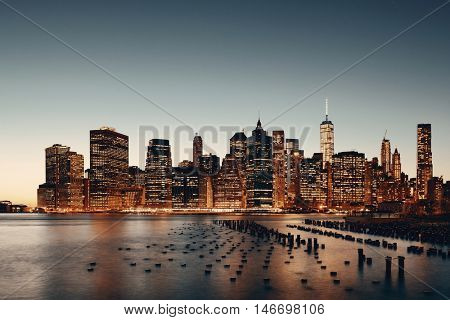 New York City downtown skyline with pier remains at dusk