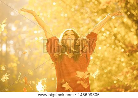 Girl Tossing Up Leaves.