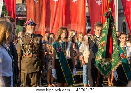 KRAKOW, POLAND - FEB 10, 2016: Unidentified participants of ceremony is the vow of first classes of the Jan III Sobieski High School (founded in 1883) at the Main Market Square near St.Mary Cathedral.