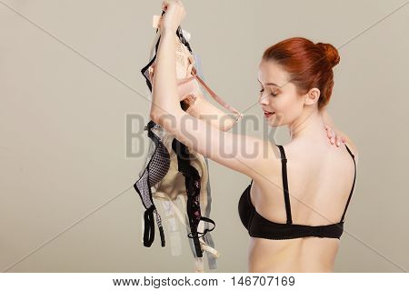 Woman Choosing Bras To Wear