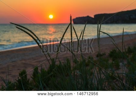 Sun rises over the Sea of Azov on Generals beach. Karalar regional landscape park in the Crimea.