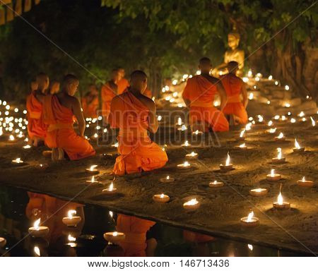 Chiang Mai, Thailand - May 20: Thai Buddhist Monks Meditate With .candle Lighting During The Religio