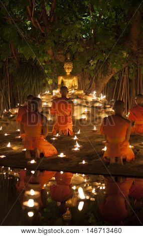 Chiang Mai, Thailand - May 20: Thai Buddhist Monks Meditate With .candle Lighting During The Religio