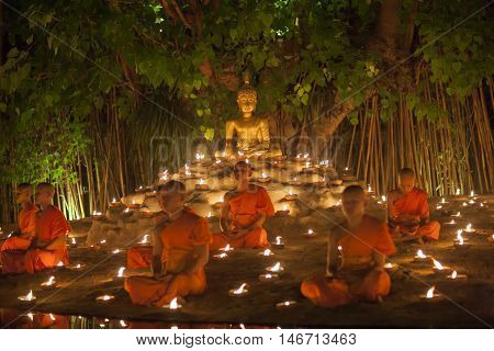 Chiang Mai, Thailand - May 20: Thai Buddhist Monks Meditate With .candle Lighting During The Religio