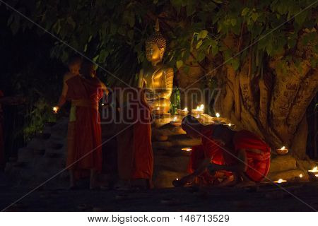 Chiang Mai, Thailand - May 20: Thai Buddhist Monks Meditate With .candle Lighting During The Religio