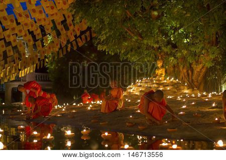 Chiang Mai, Thailand - May 20: Thai Buddhist Monks Meditate With .candle Lighting During The Religio