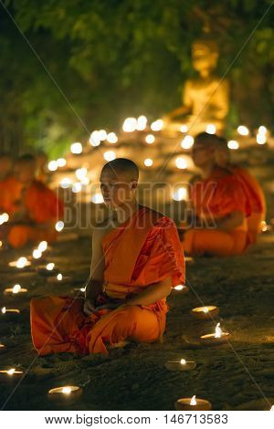 Chiang Mai, Thailand - May 20: Thai Buddhist Monks Meditate With .candle Lighting During The Religio
