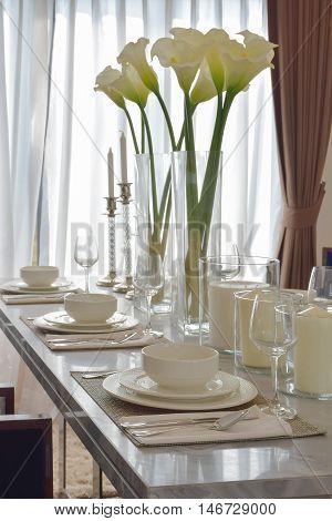 elegant table set on marble dining table in modern style dining room interior