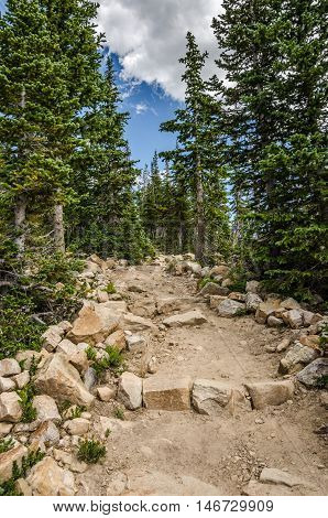 Hiking trail made with dirt and rocks in the Uinta Mountains in Utah