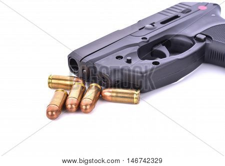Bullets with the gun on white background .