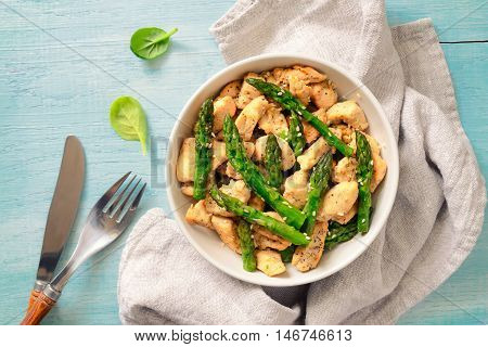 Asparagus and chicken roasted and seasoned with sesame seeds