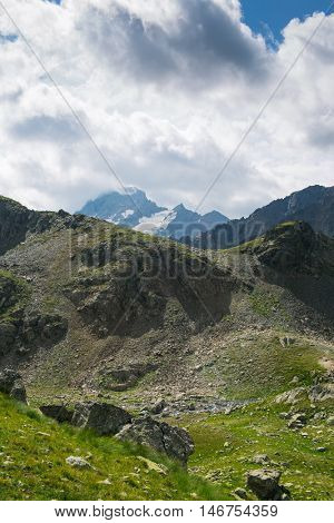 mountain under sky with dramatic clouds