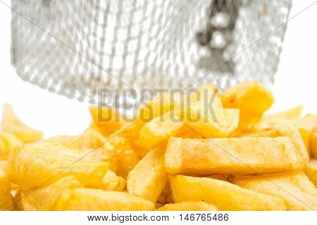fried potatoes and frying pan basket on a white background