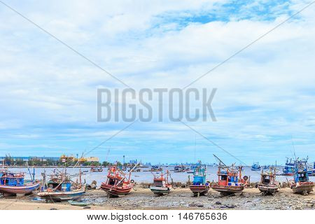 fishing boat aground on beach and bluesky
