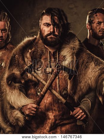 Mad vikings warriors posing in studio.