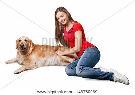 Portrait of cute lass embracing her fluffy dog while lying on grass