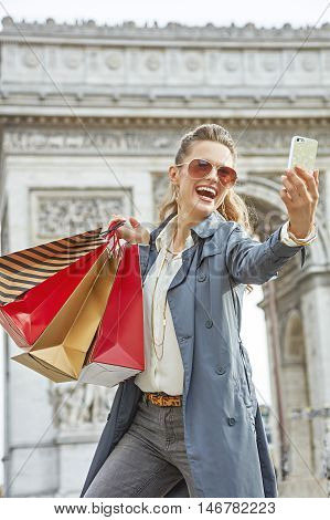Woman Shopper Near Arc De Triomphe Taking Selfie With Cellphone