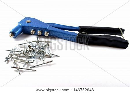 Pop rivet gun and pop rivets with white background.