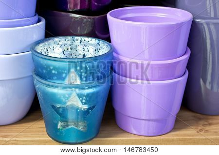 new violet flowerpots in a shelf in a market