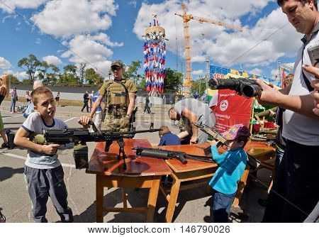 Boy Takes Aim With A Machine Gun