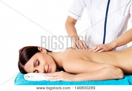 Woman having massage of body in the spa salon. Beauty treatment concept.