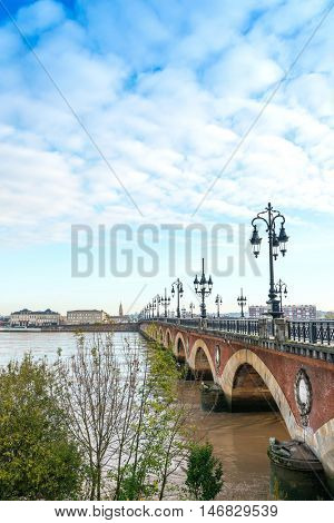 Old stony bridge in Bordeaux, France Europe