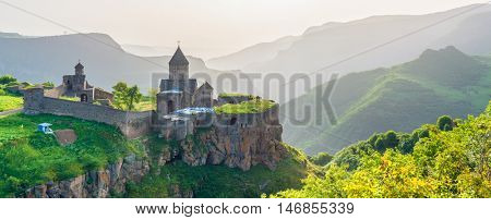 Beautiful view of ancient monastery in setting sun. Tatev. Armenia