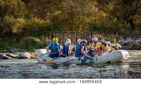 Village Mygiya, Nikolaev region, Ukraine - September 10, 2016: Rafting on the Southern Bug River. An experienced instructor holds the key to a great adventure. Rafting in Ukraine. Risky, bold action.
