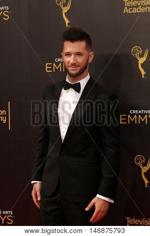 LOS ANGELES - SEP 11:  Travis Wall at the 2016 Primetime Creative Emmy Awards - Day 2 - Arrivals at the Microsoft Theater on September 11, 2016 in Los Angeles, CA