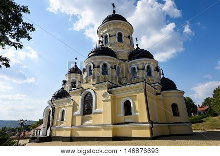 Photo of Capriana Monastery in Moldova with blue sky