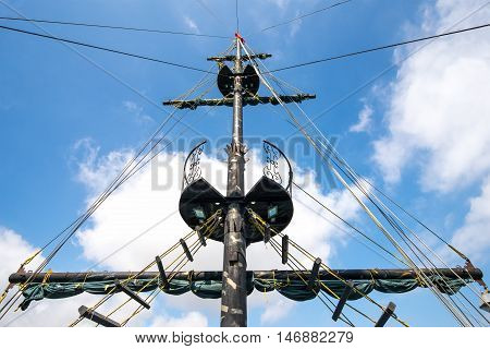 Mainmast of an old ship in fort of the sky