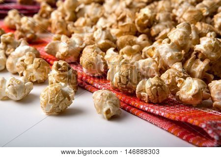 large caramel popcorn on a napkin close up