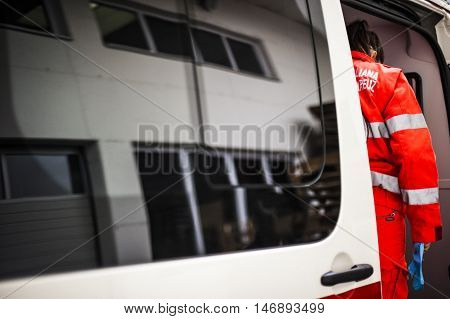 girl emergency volunteer operator in an ambulance called for emergency situation