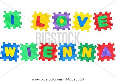 Message I Love Wienna from letters puzzle isolated on white background.