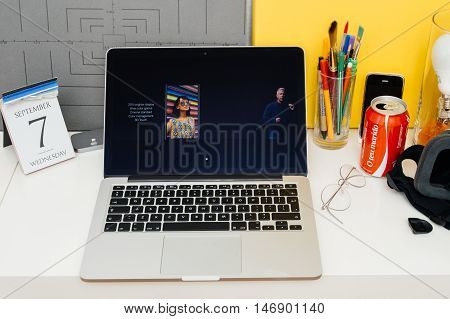 PARIS FRANCE - SEP 8 2016: Apple Computers website on MacBook Retina in room environment showcasing live coverage of Apple Keynote - presentation of iPhone new photo camera double camera