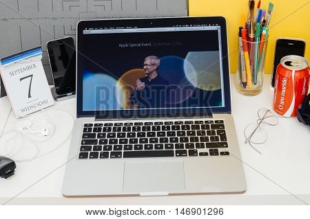 PARIS FRANCE - SEP 8 2016: Apple Computers website on MacBook Retina in room environment showcasing live coverage of Apple Keynote - Tim Cooke welcoming guests
