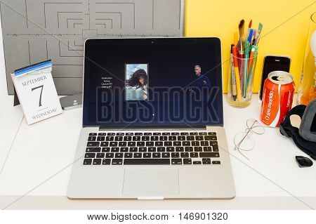 PARIS FRANCE - SEP 8 2016: Apple Computers website on MacBook Retina in room environment showcasing live coverage of Apple Keynote - presentation of iPhone new photo camera double camera